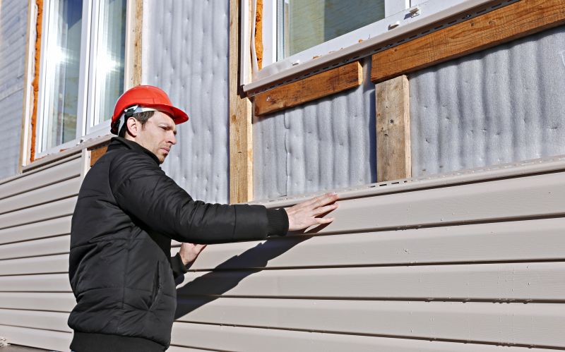 Professional Siding Contractor at Work